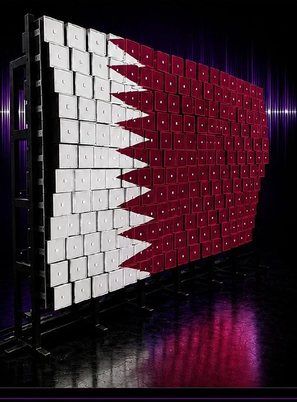 Kinetic LED wall with its modules pushed out to form the flag of Qatar